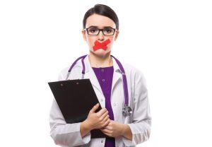 we see a female physician in a lab coat with stethescope and clipboard. she has red tape on her mouth because she has a secret about testosterone that she'd like to share.